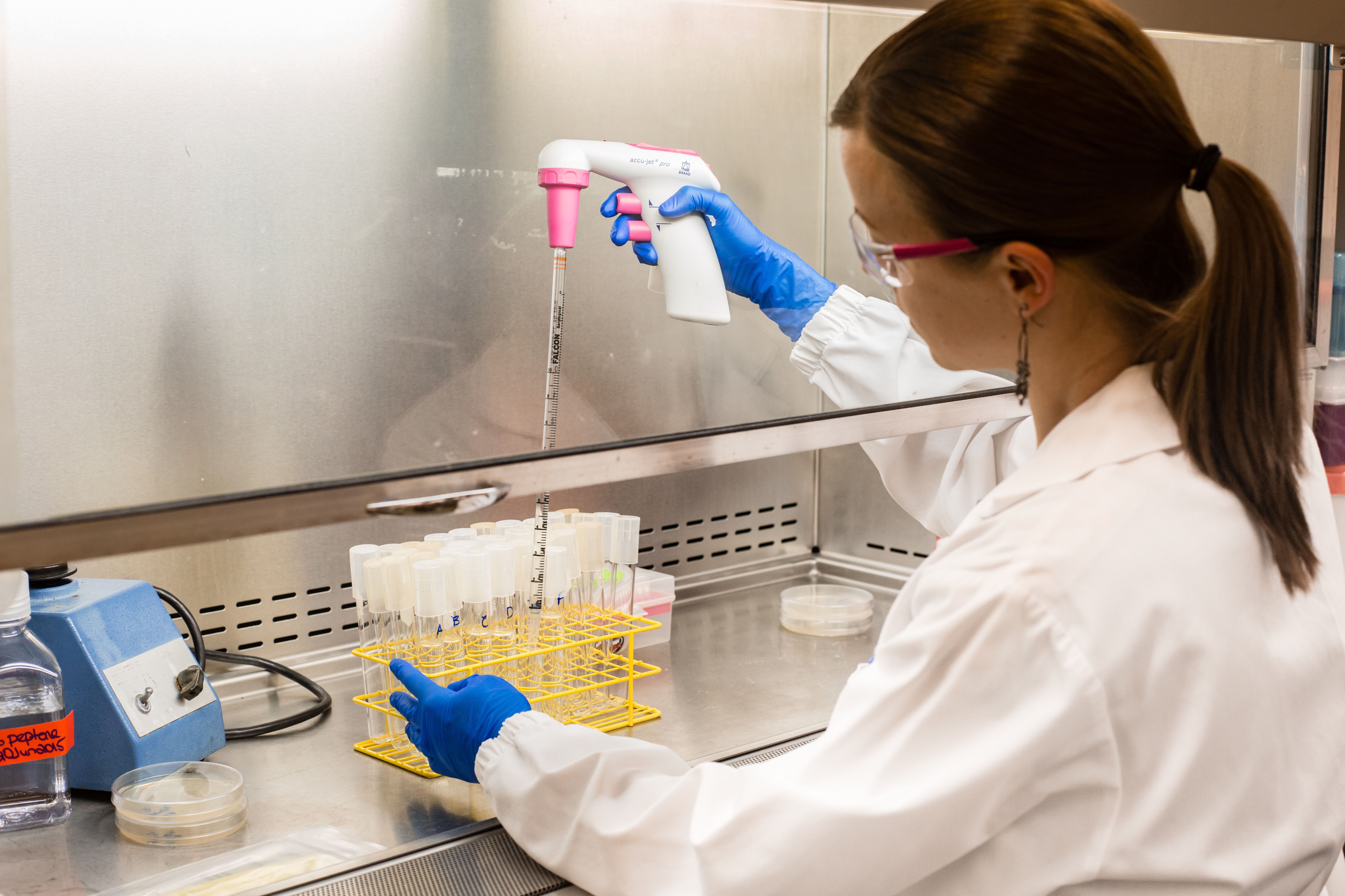 a quality coordinator prepares samples at SRC's fermentation lab