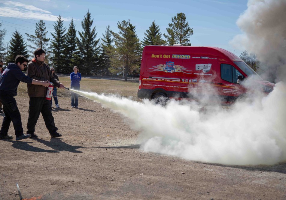 src employees in fire extinguisher training as part of naosh week