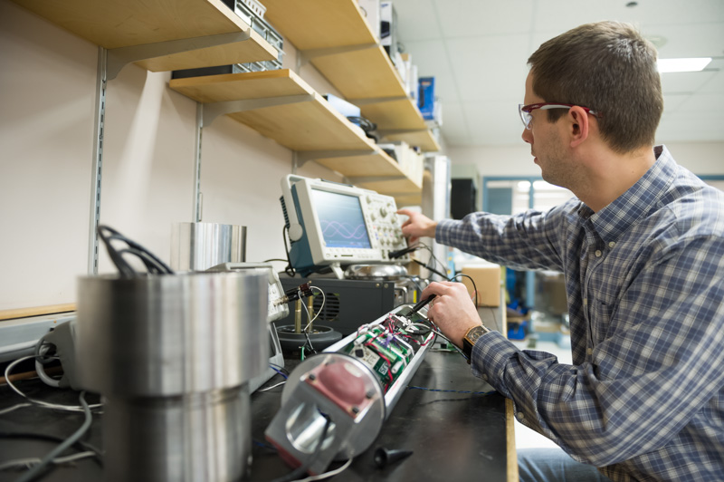 engineer works on custom equipment at SRC lab