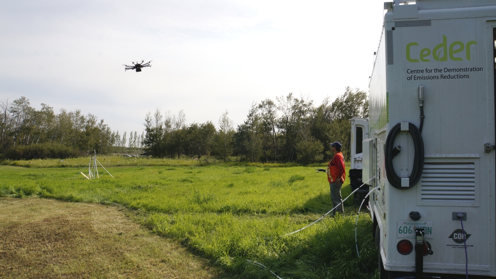 src drone flies beside ceder trailer for gas detection