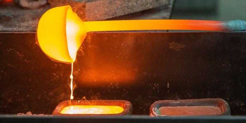 a ladle pouring molten rare earths into molds at src's rare earth smelting pilot plant