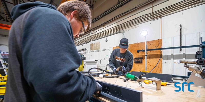 two students in src's plastic welding program with nw college