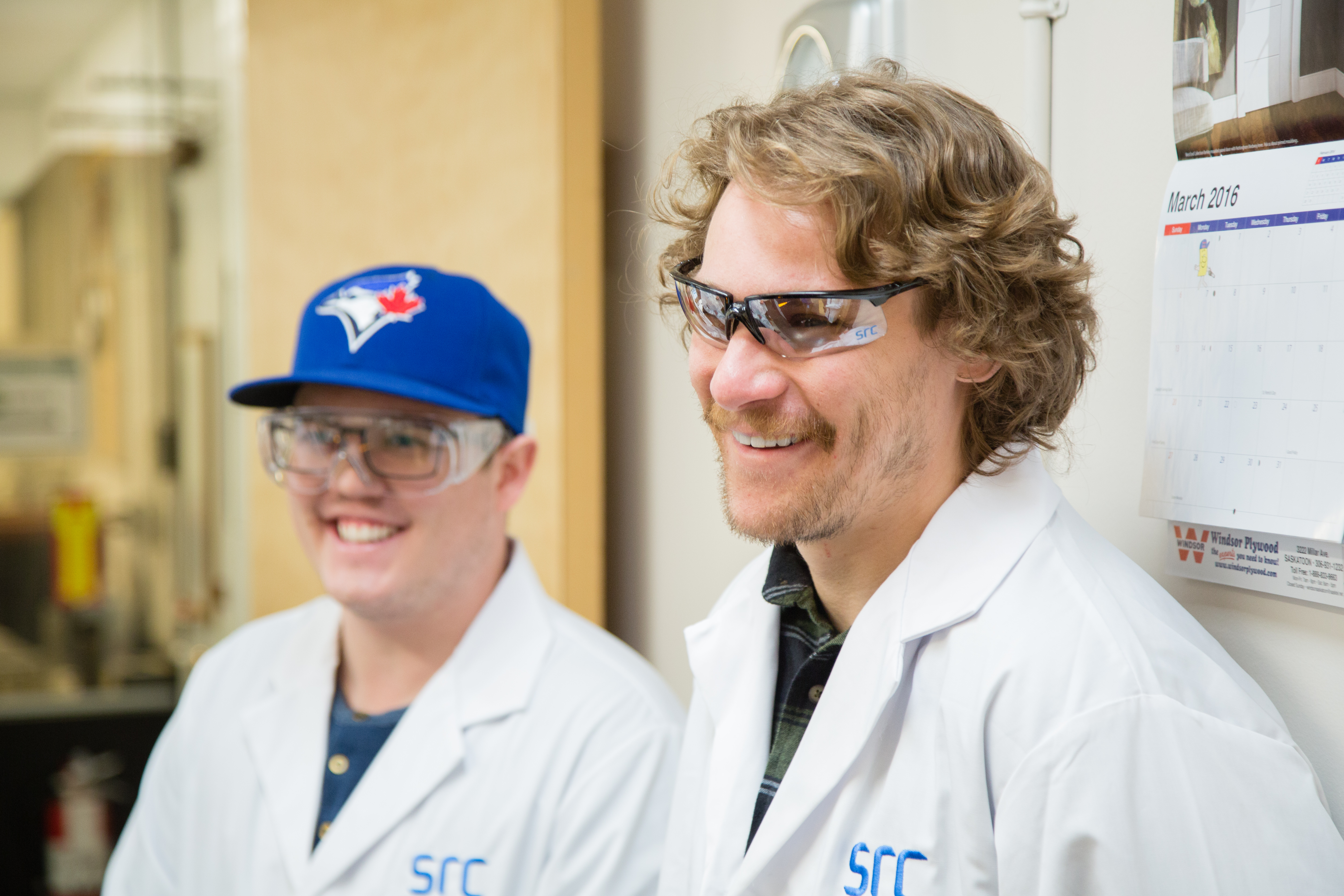 Two students in lab coats