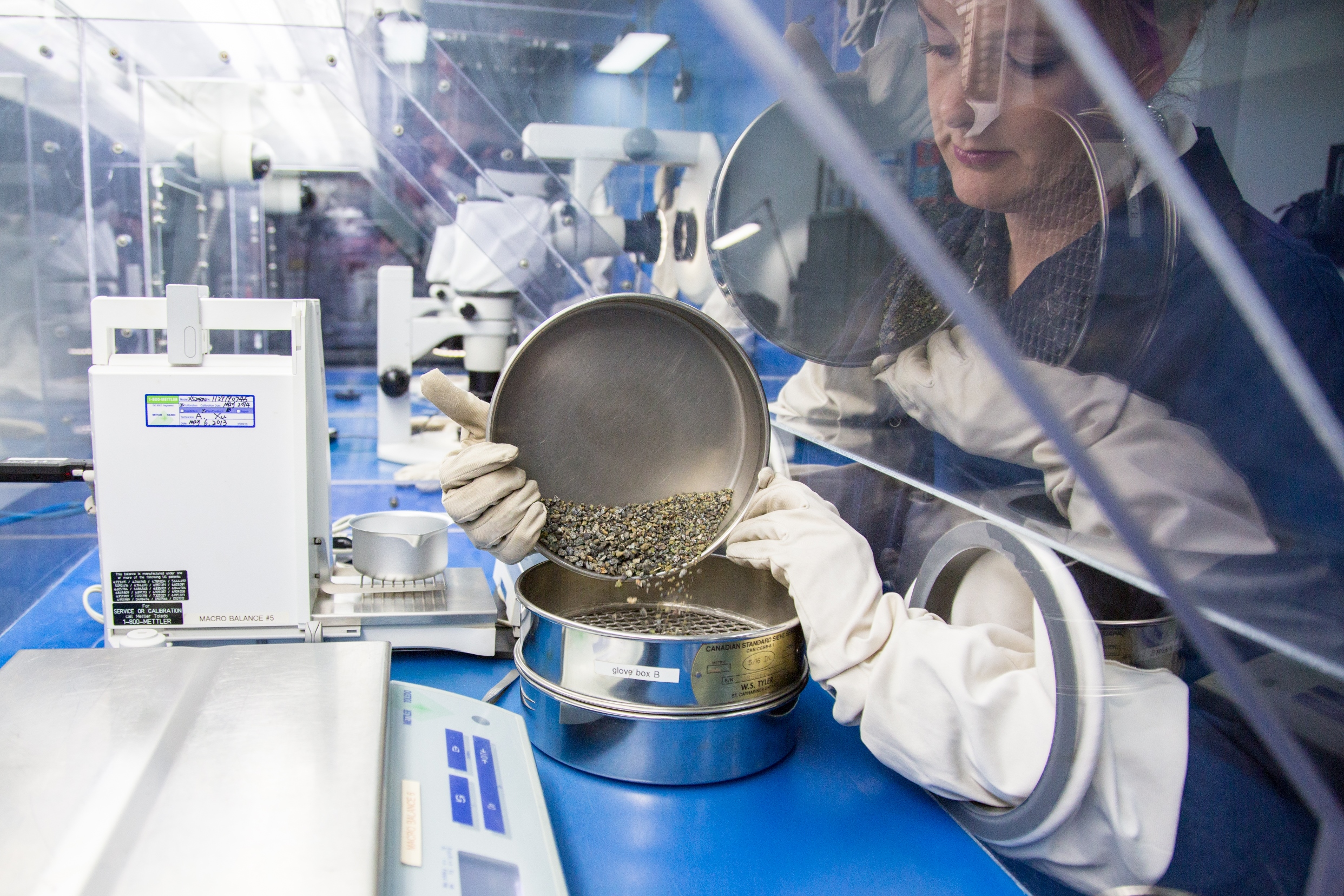 Women holding sort pan in glove box