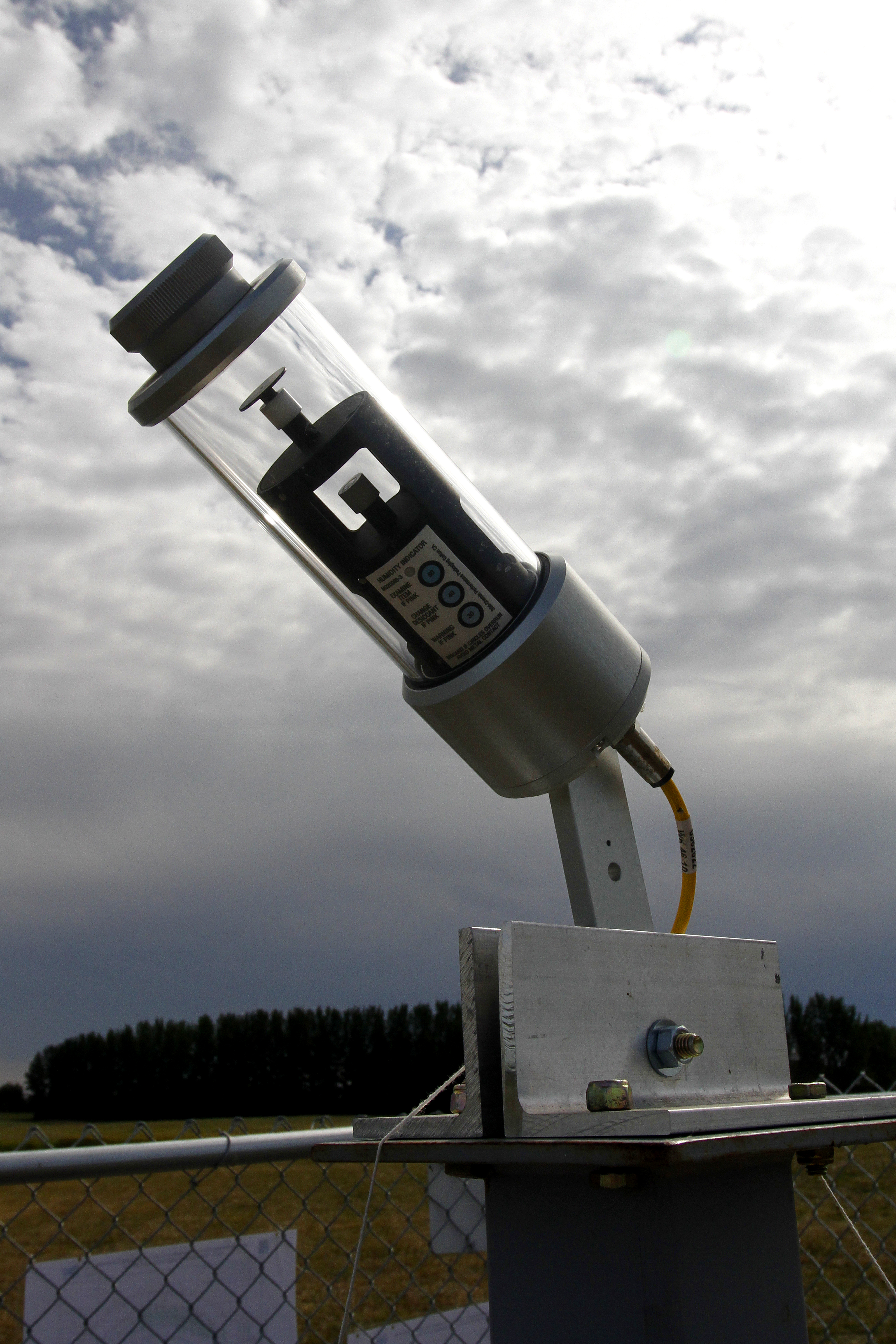 Glass cylinder equipment pointed at sky