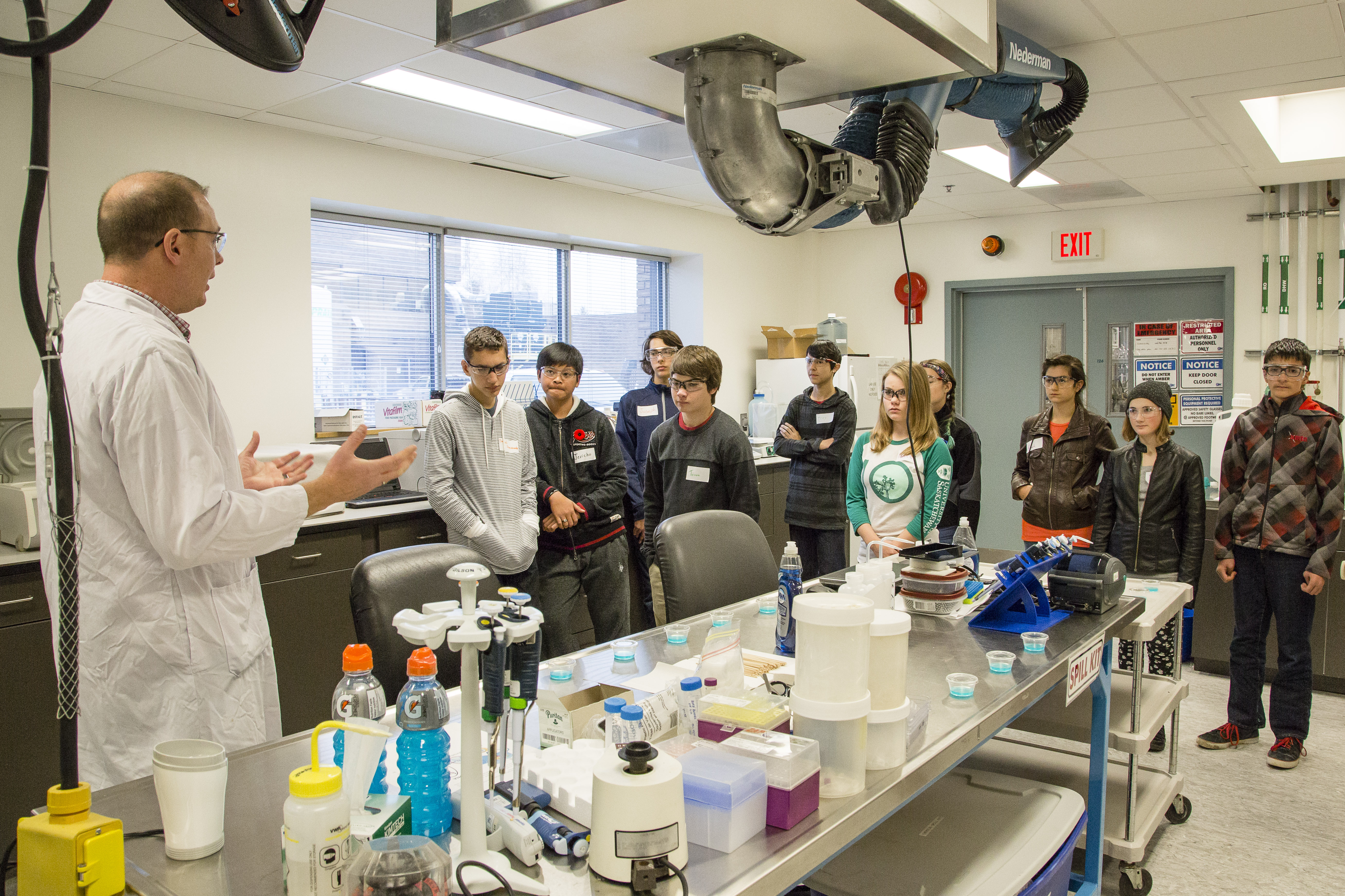 Students in a lab listening to instructor