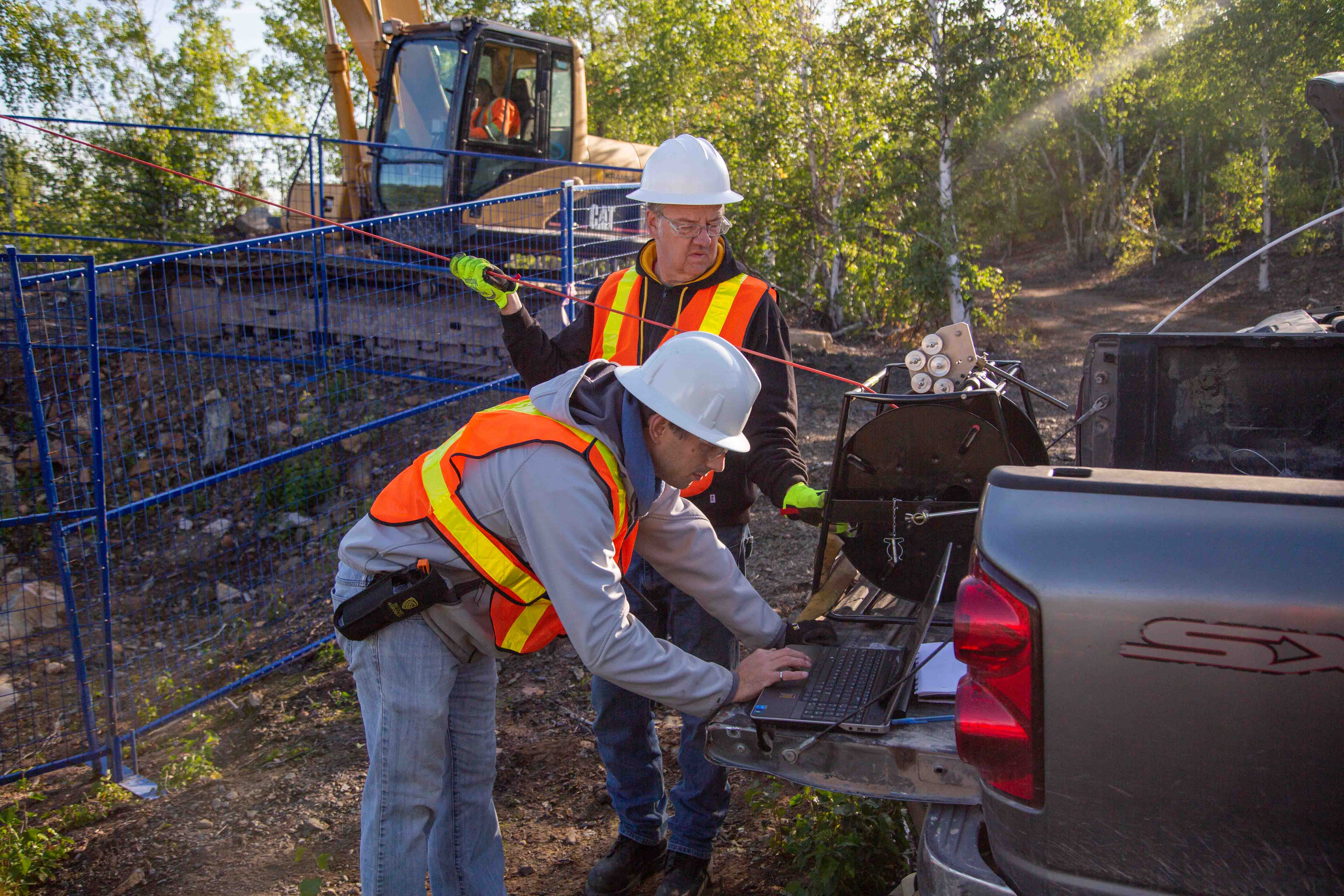 two engineers working at abandoned mine site