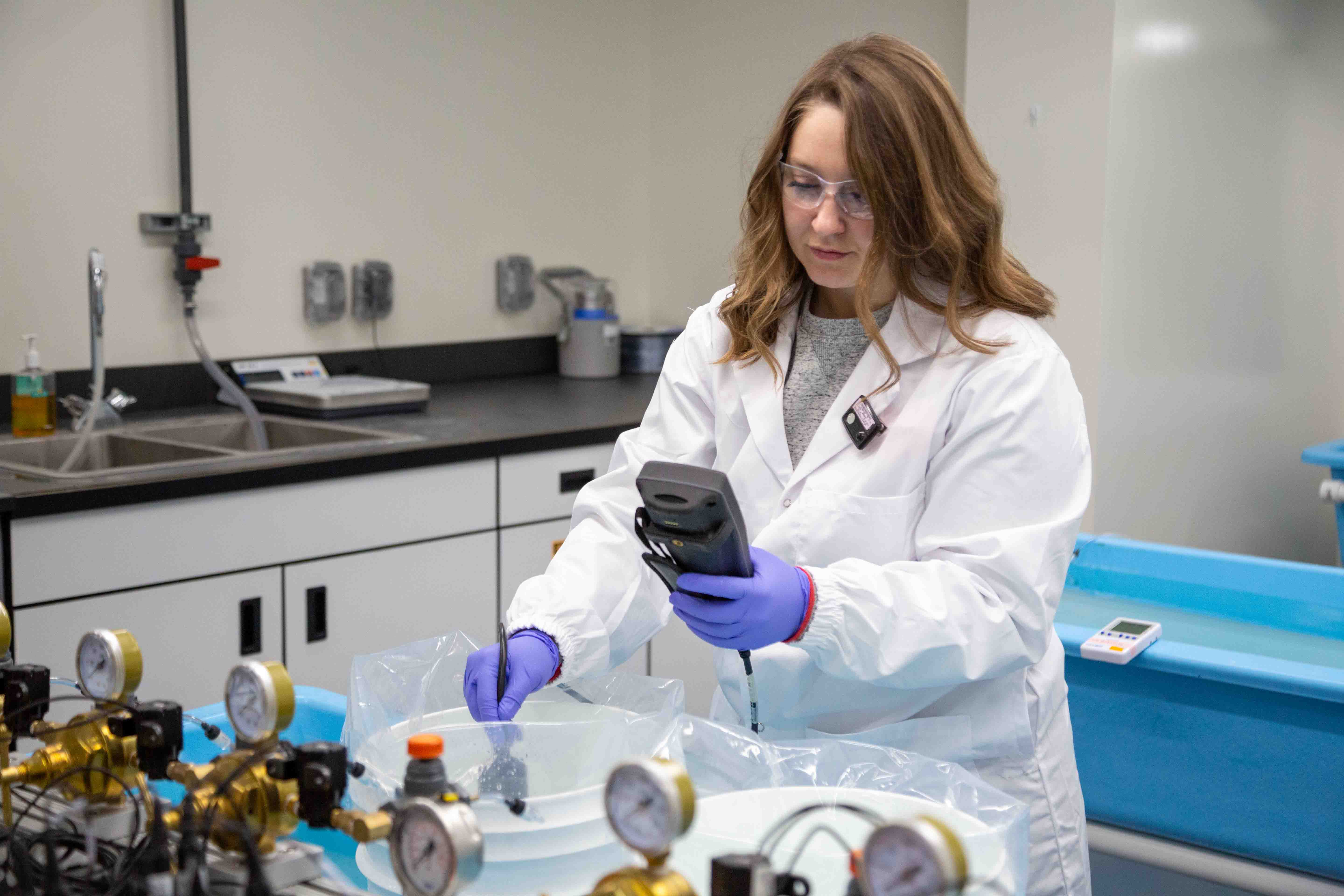 female employee working in aquatic lab