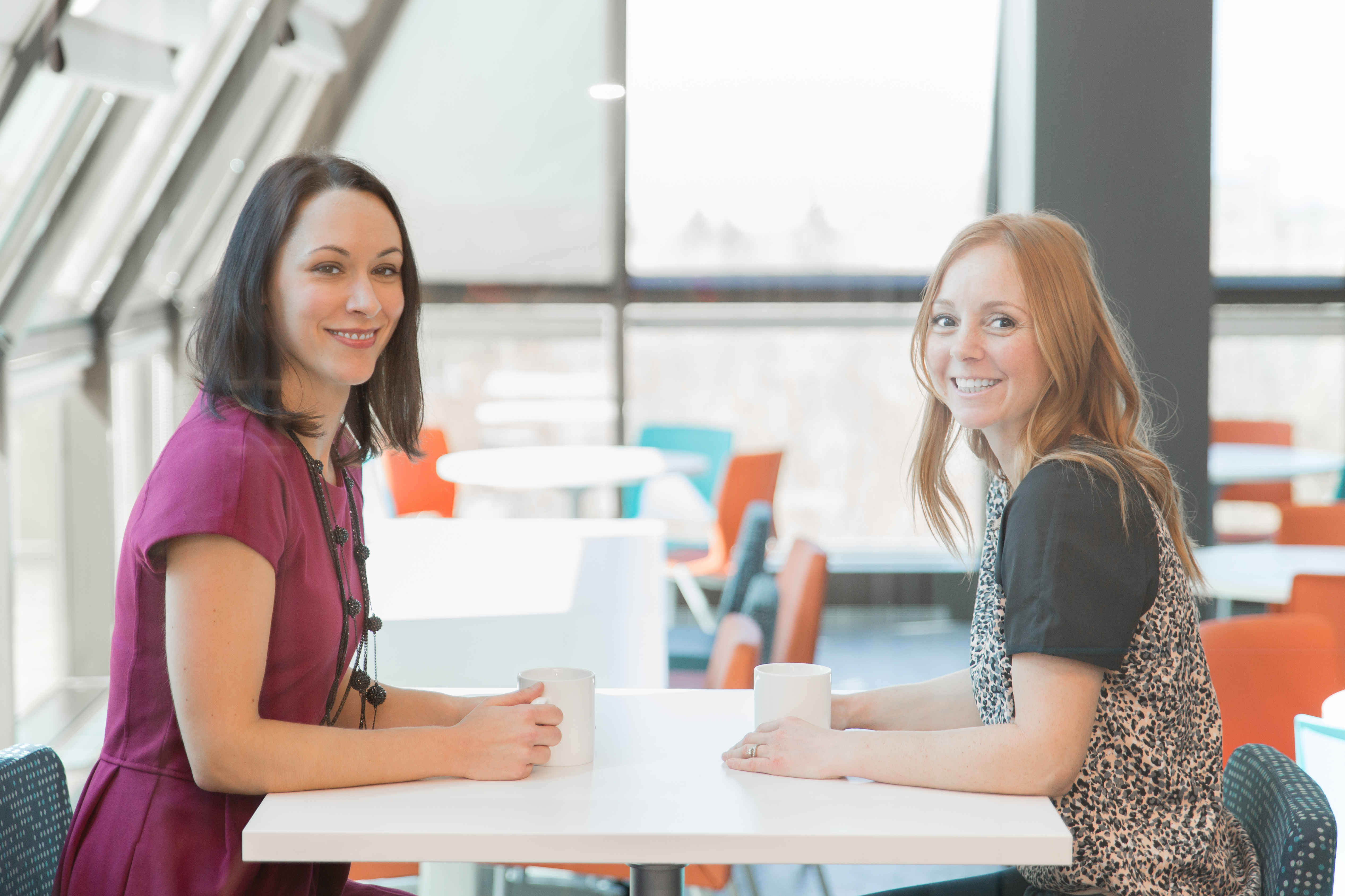 two women sitting at a table