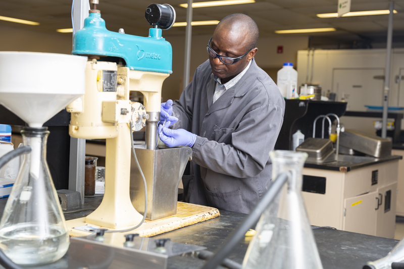 src employee conducts potash test