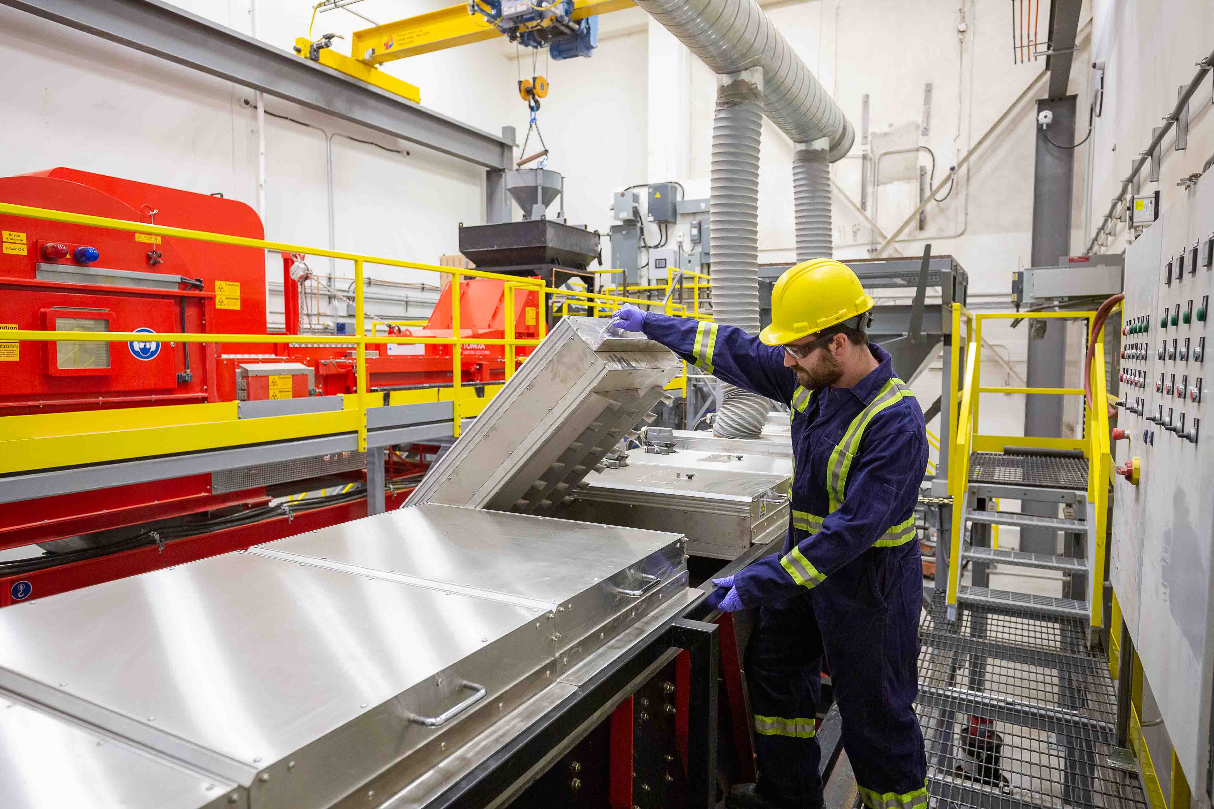 src technician uses sensor-based sorting machine