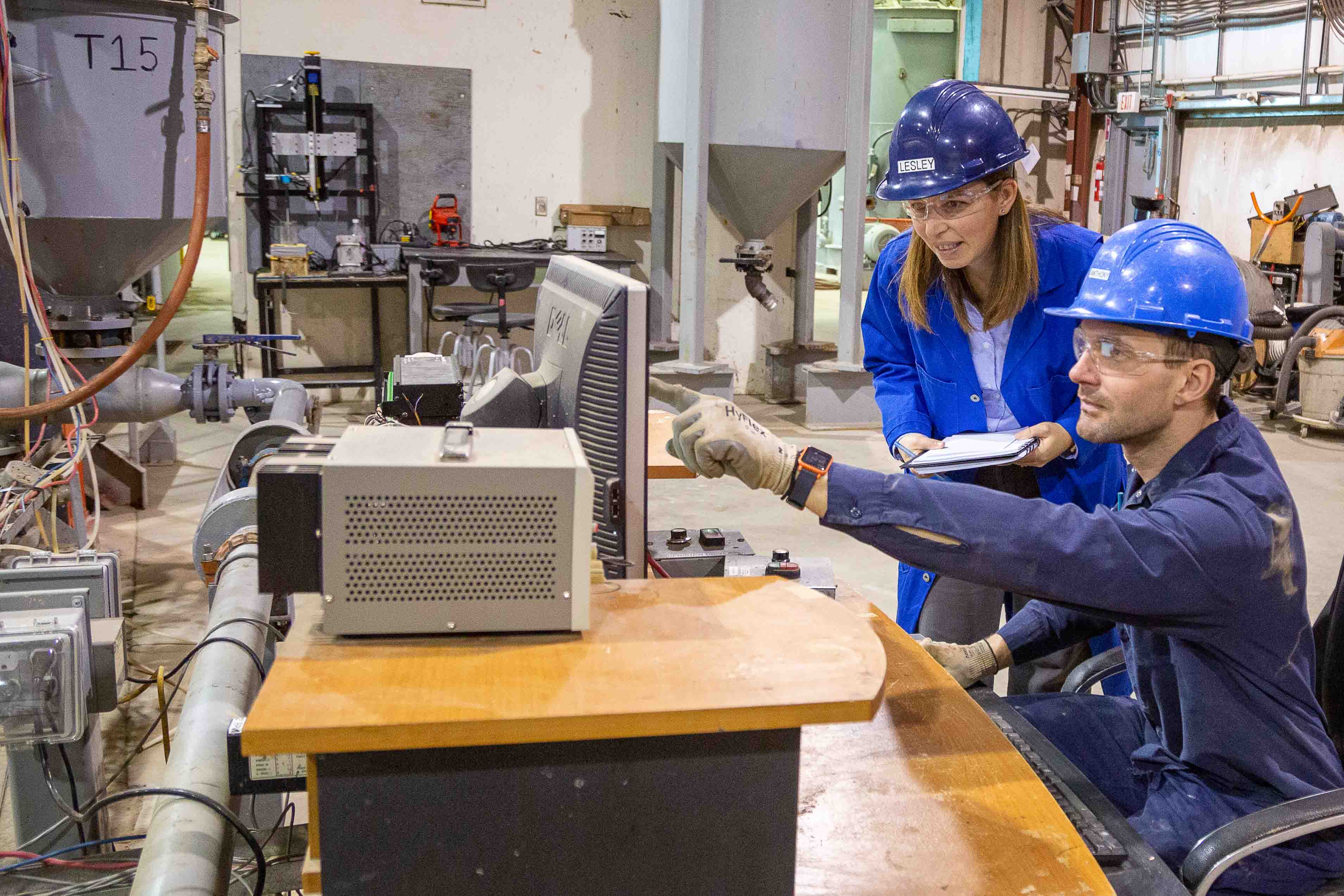 lesley mcgilp talks with team member at src's pipe flow facility