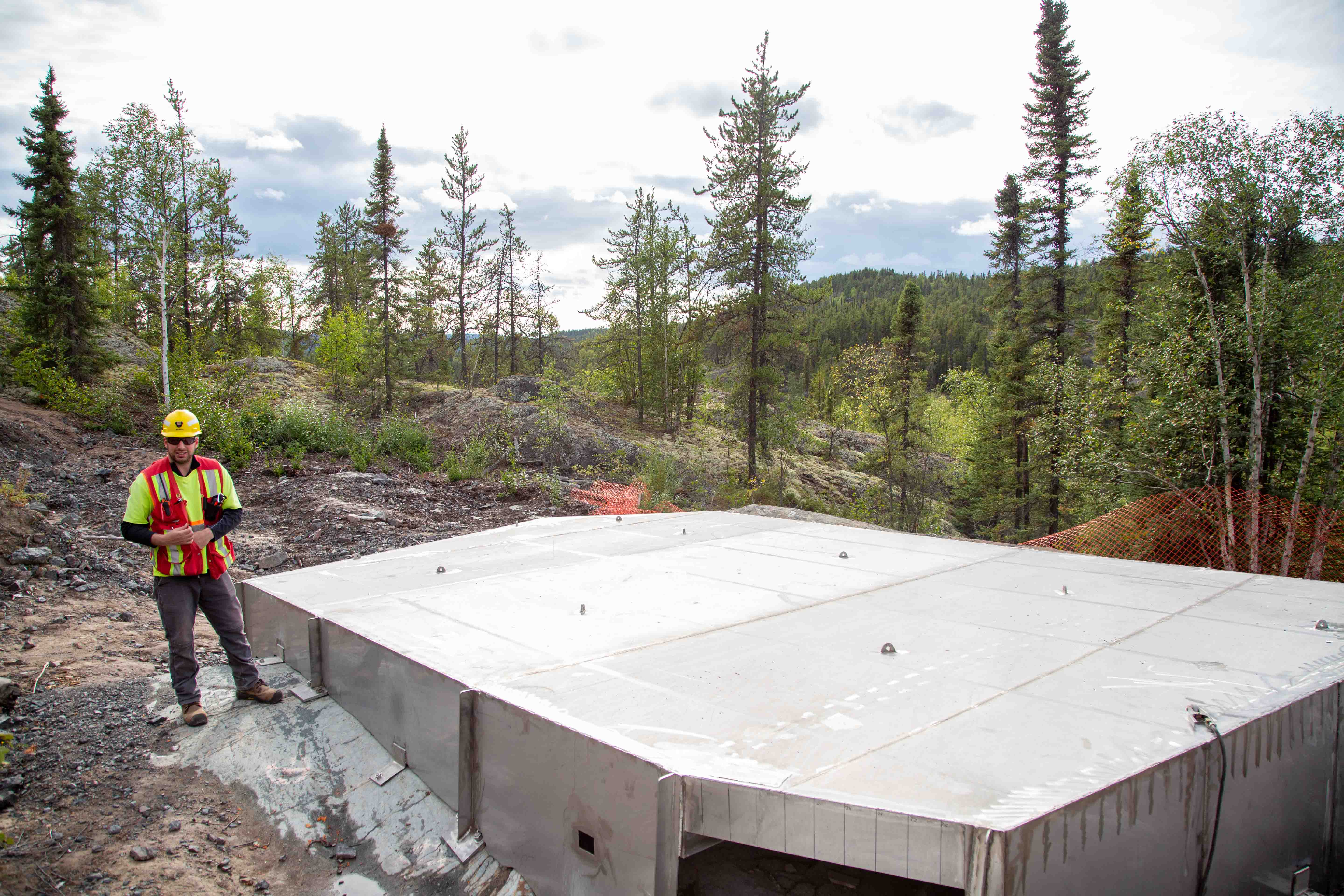 src remediation specialist inspects stainless steel cap