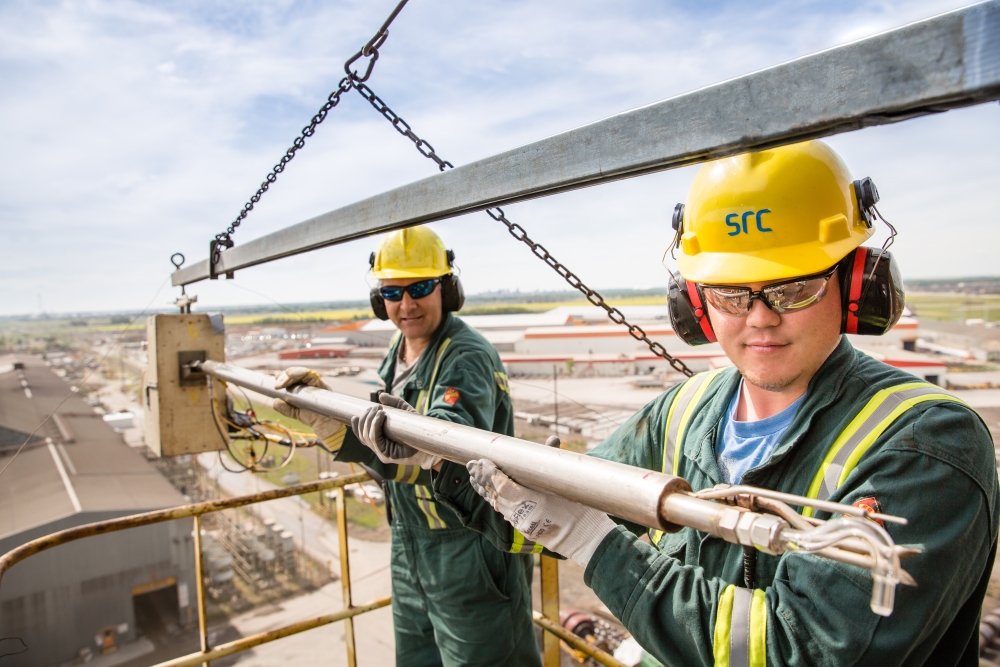 two workers stack sampling