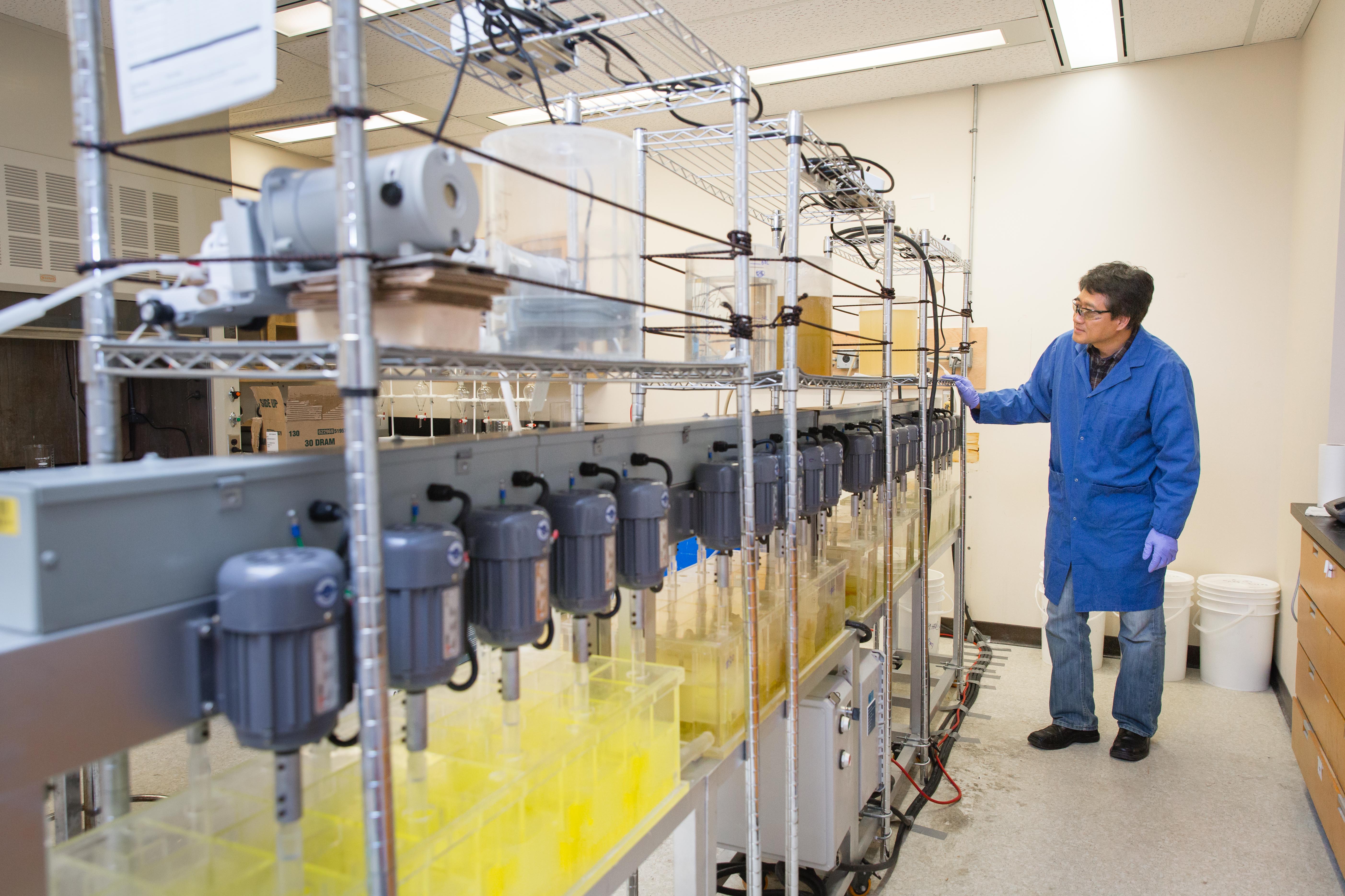 An SRC employee oversees the rare earth solvent extraction process