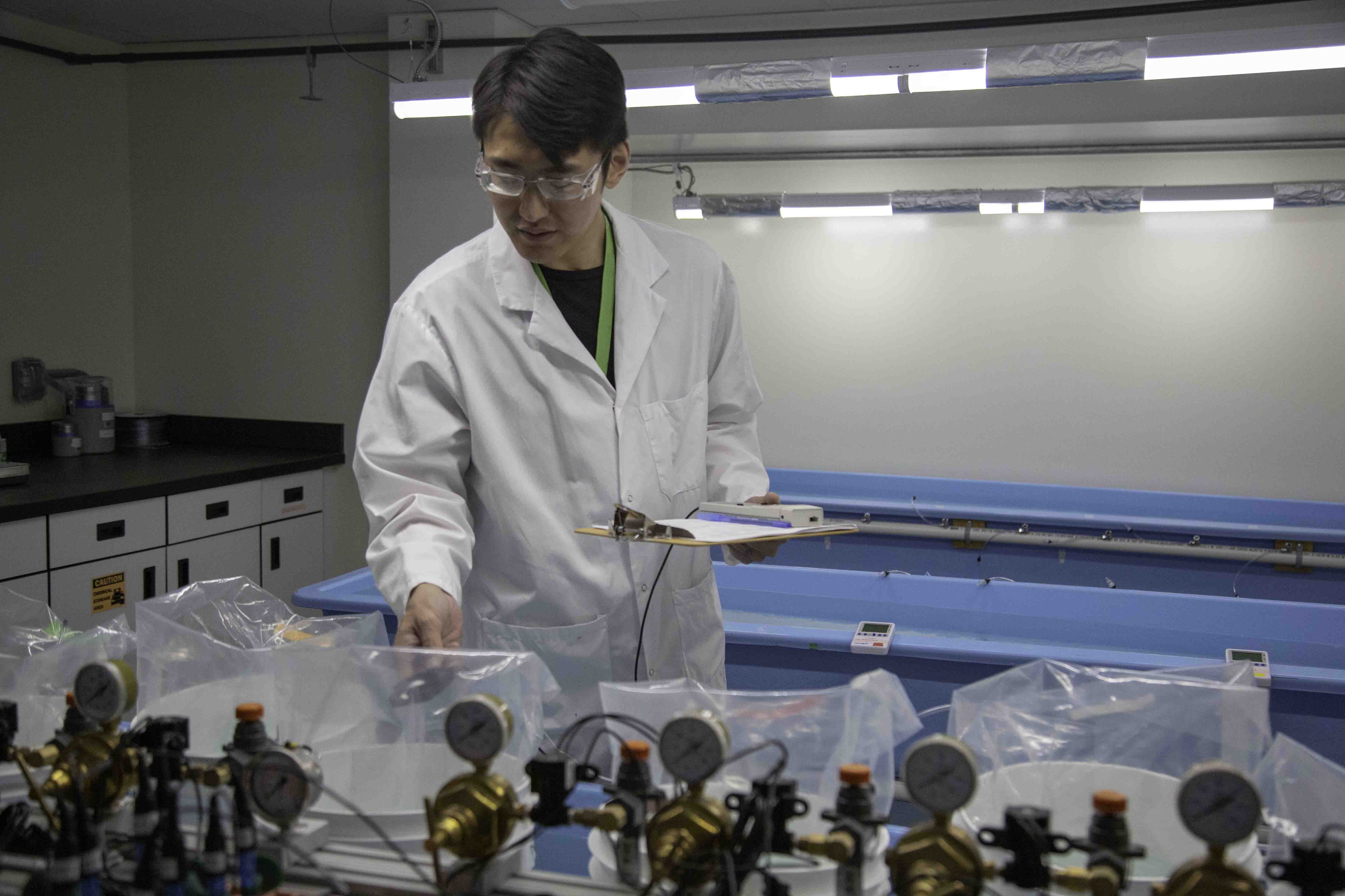 src aquatic expert performs tests in lab