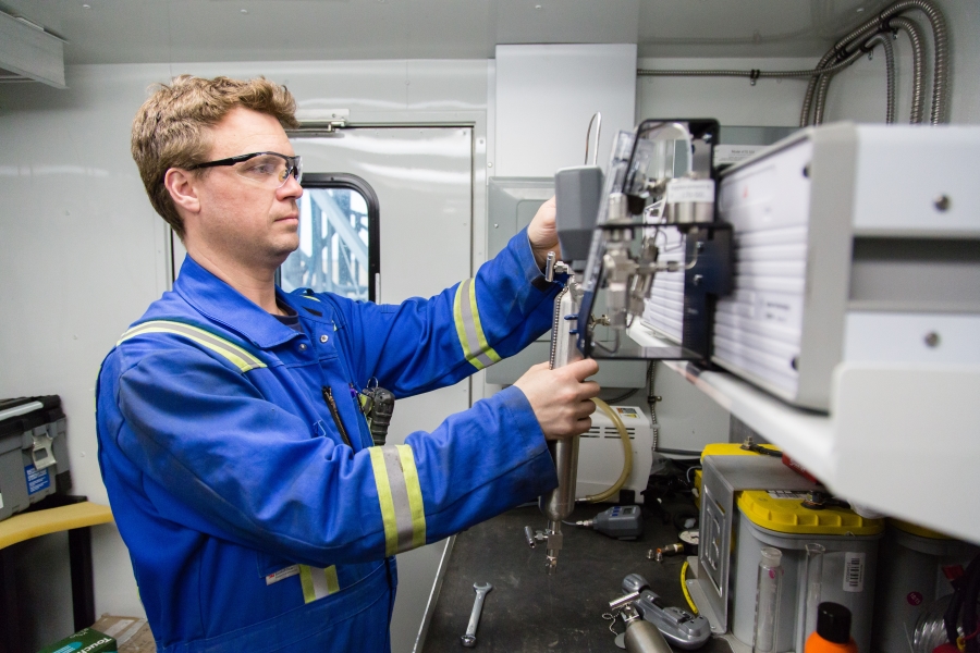 src employee works in mobile emissions trailer