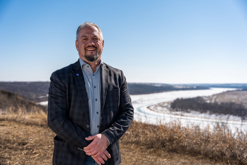 Mark director of indigenous relations at src in front of south saskatchewan river