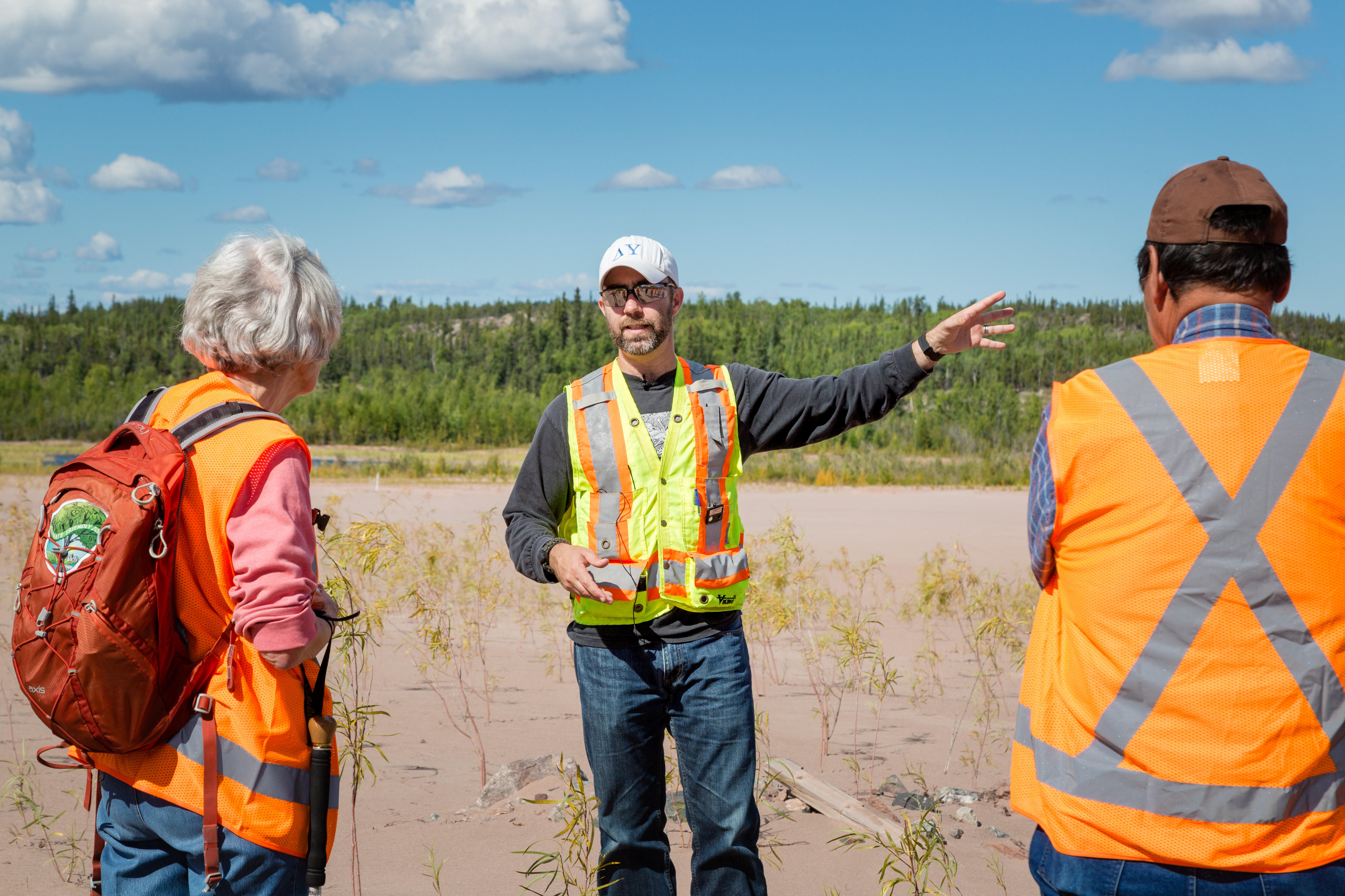 three people in safety vests