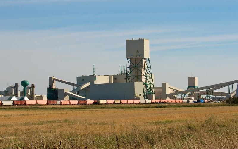 Saskatchewan potash mine behind wheat field