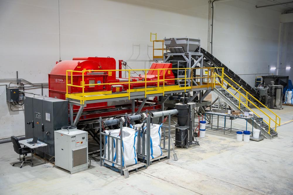 interior of src's mineral liberation sorting centre with red xrt sorter in middle of facility