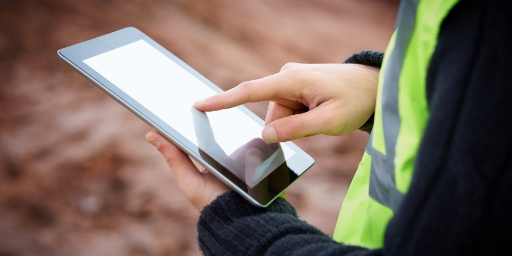 SRC employee documenting safety on ipad