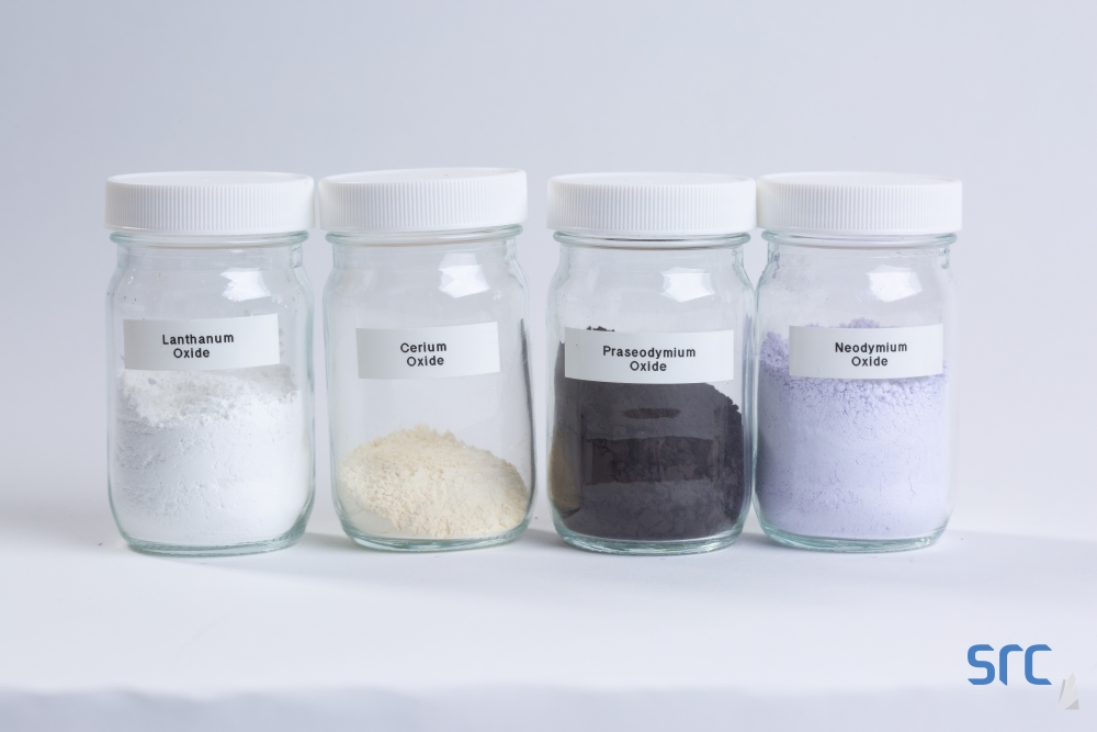 four jars of rare earth elements at src