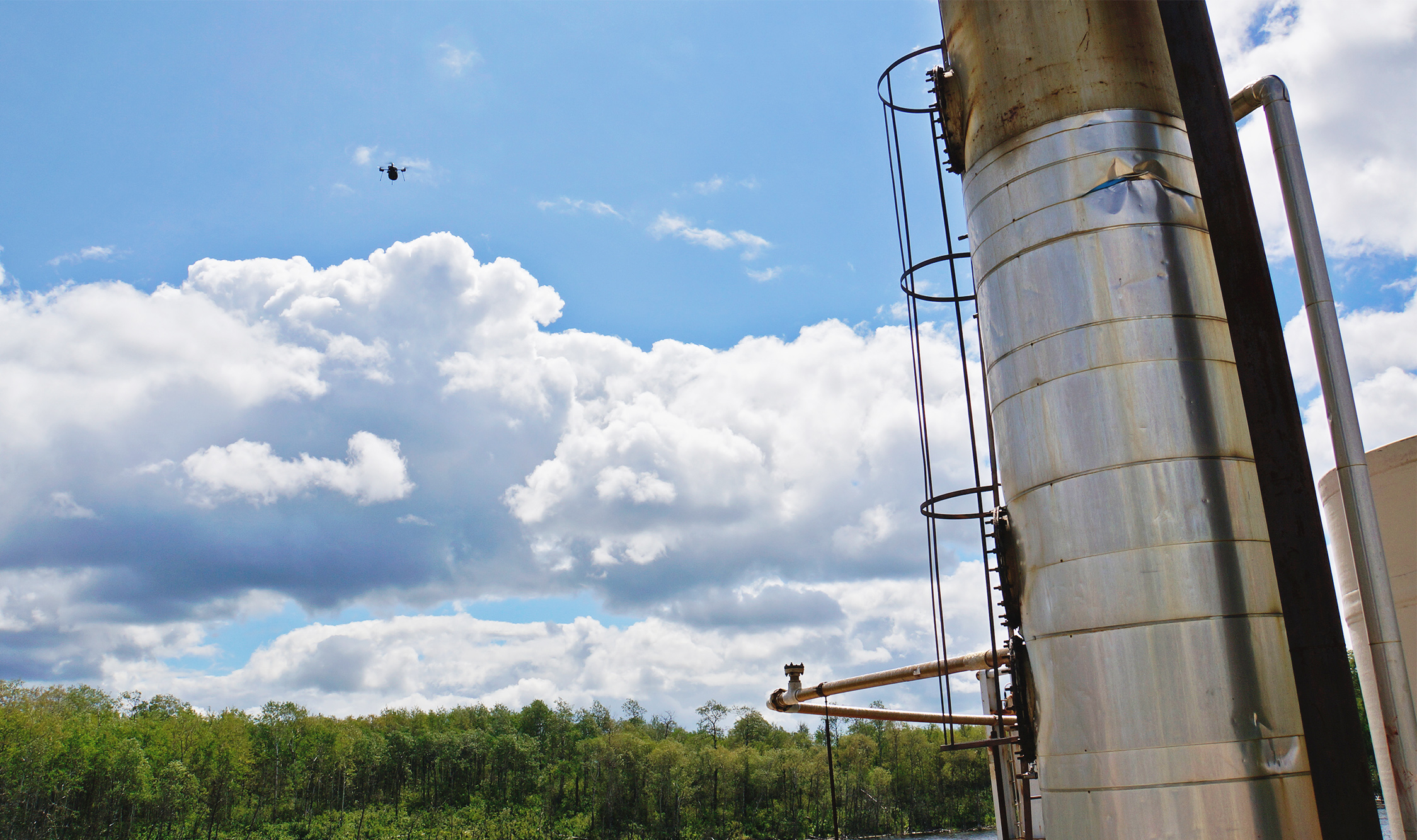 src uav flying around a work site sampling air quality