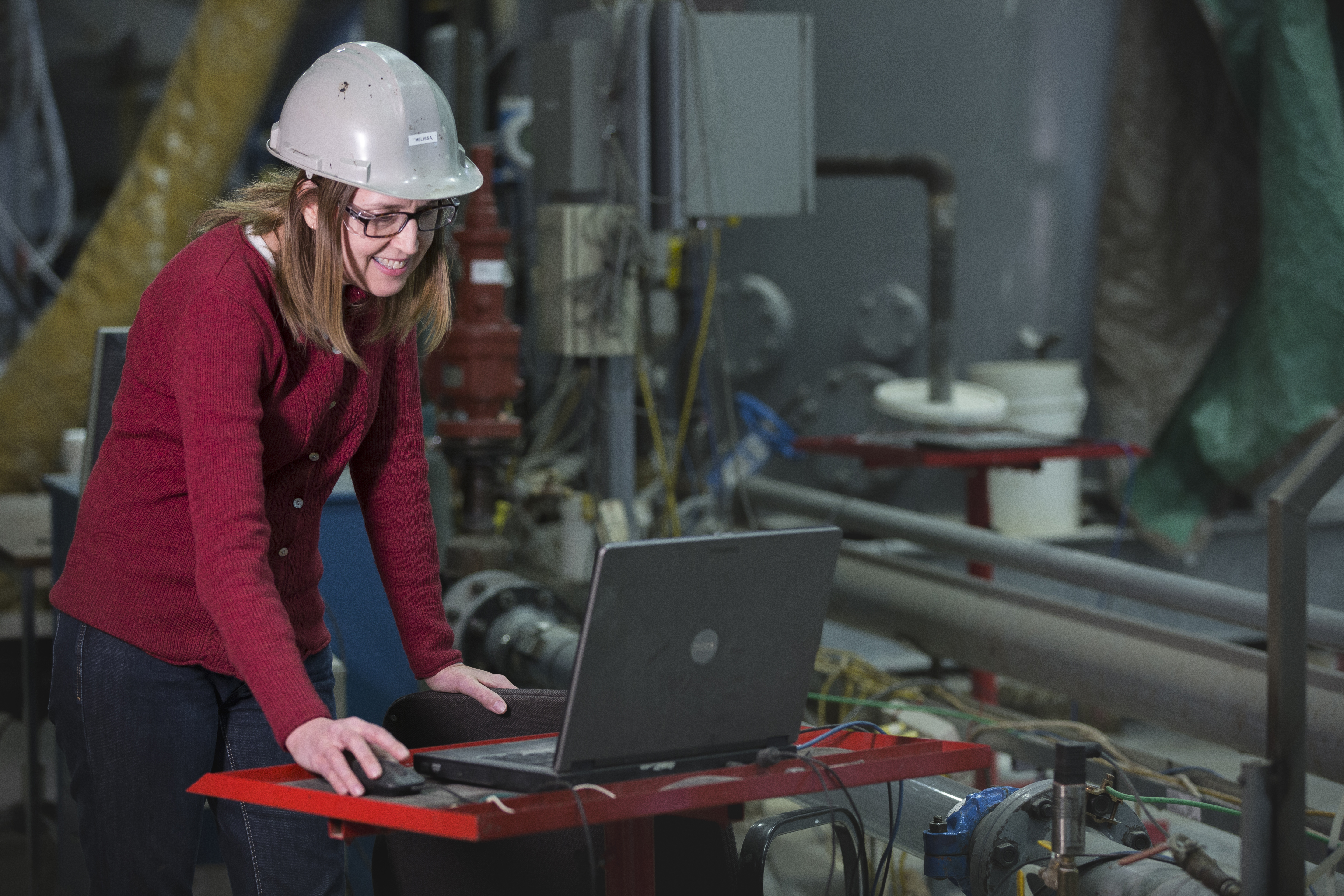 female engineer working at computer in lab