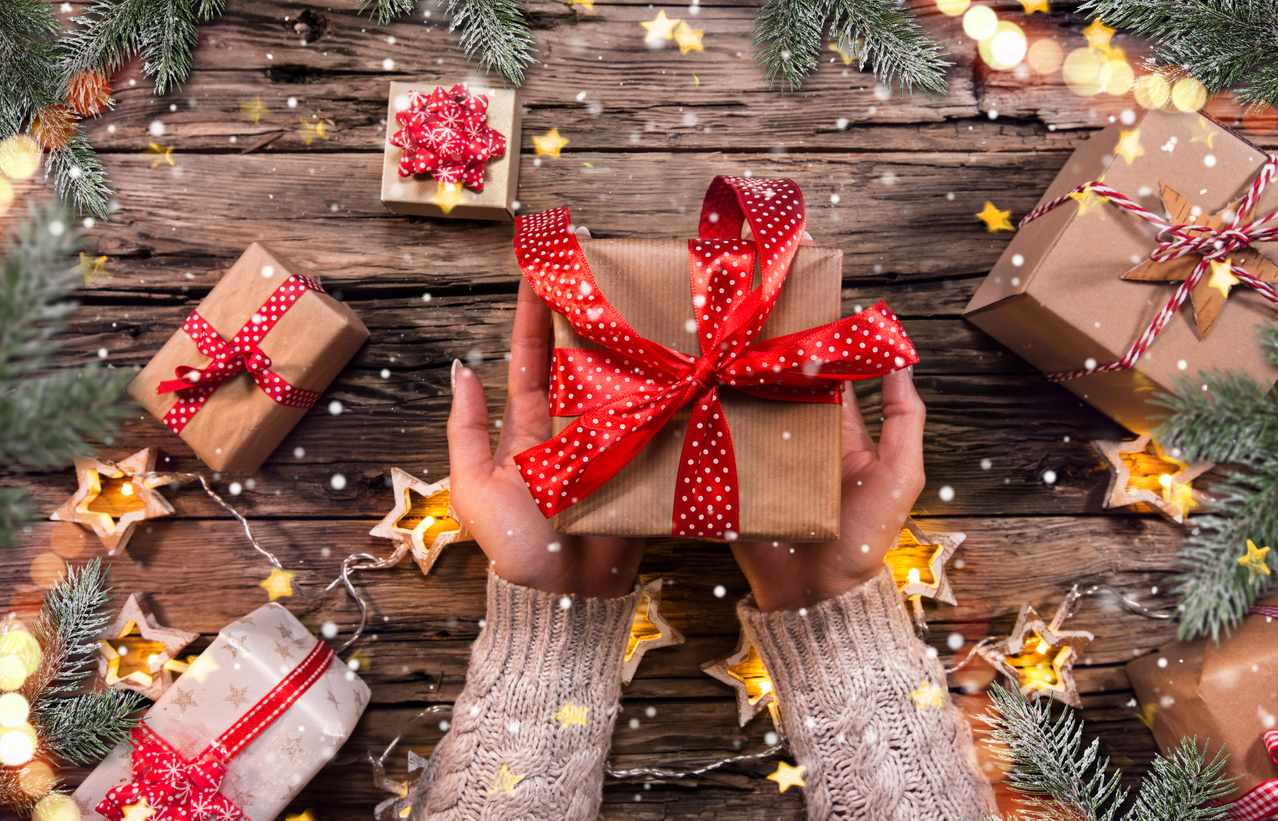 src woman's hands holding science gift