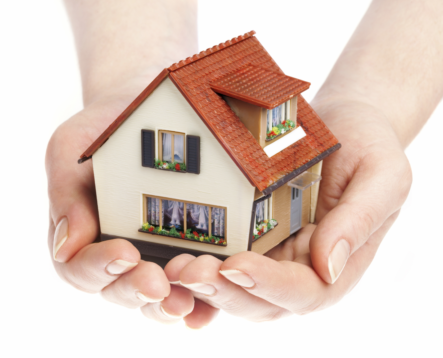 hands holding a model house