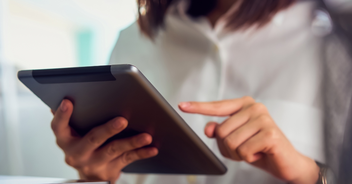 businesswoman holding tablet