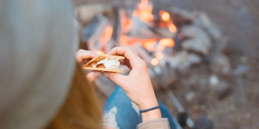 woman eating a smore after doing src science experiment