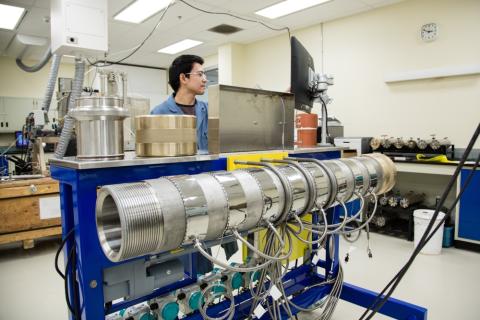 SRC engineer with dual-permeability core flood apparatus in SRC lab