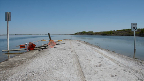 Gravel road closed because of flooding