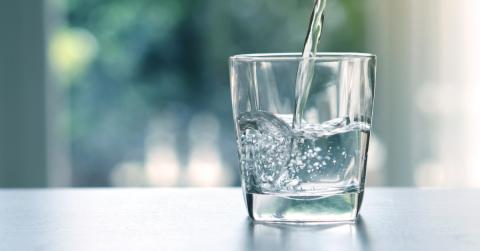 water pouring into glass src tests for lead in drinking water