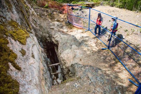 two src environmental remediation experts examine abandoned mine opening