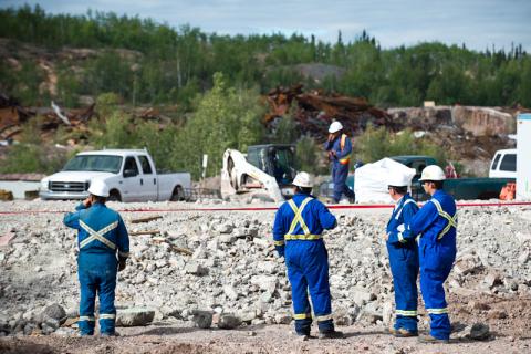 Workers in safety gear at mine site