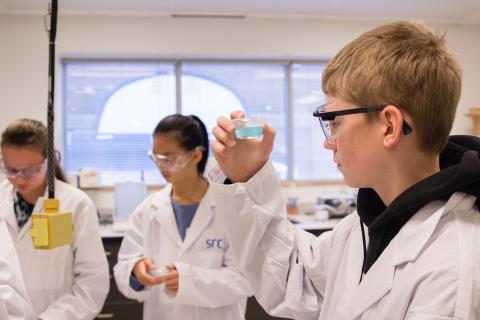 Students look at cups with Gatorade in it