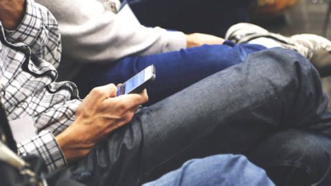 man reading text on mobile