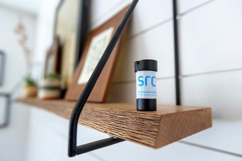 src radon detector sitting on shelf in home basement