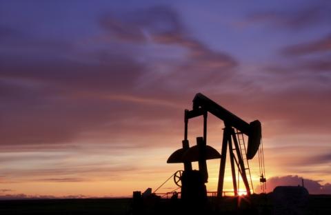 pumpjack against a purple sunset