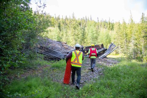 two remediation specialists install fencing at an abandoned mine site