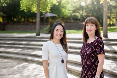 two smiling women outdoors