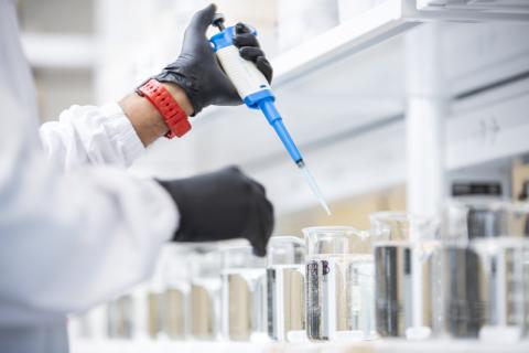 technician conducting water sampling at src's lab