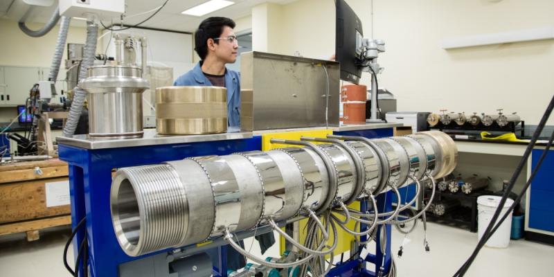 SRC engineer with dual-permeability core flood apparatus in SRC lab