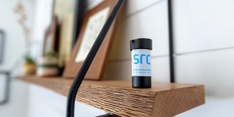 src radon detector sitting on shelf in home basement