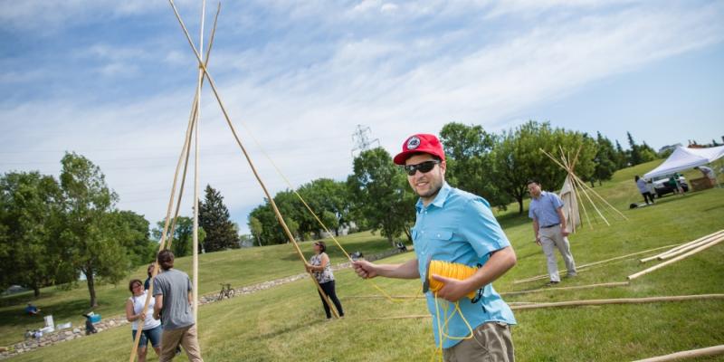 src students raise a tipi on national aboriginal day