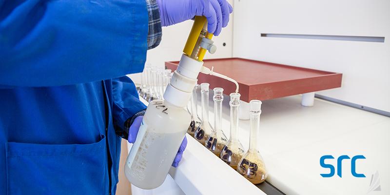 src technician preparing sample in lab
