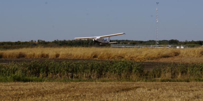 Unoccupied Aerial Vehicle flying over field